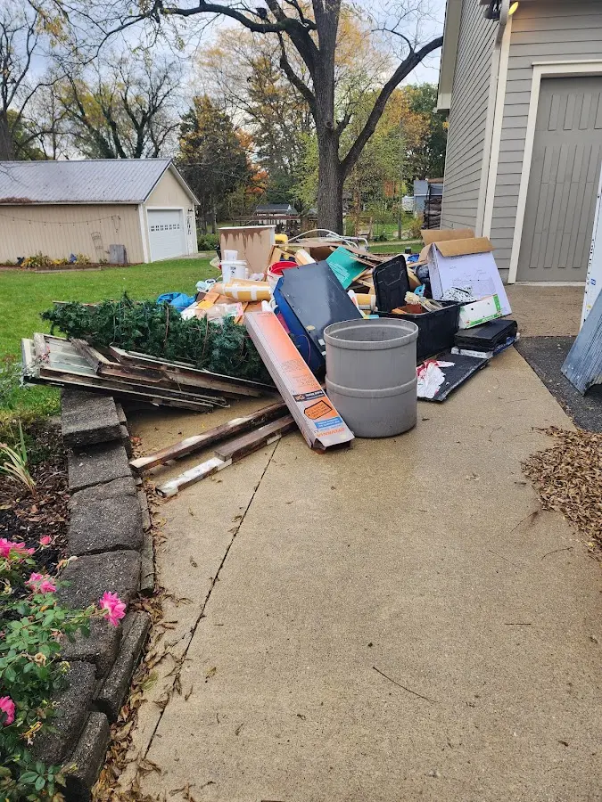 Dumpster being loaded with debris for Residential Dumpster Rental in Elverta